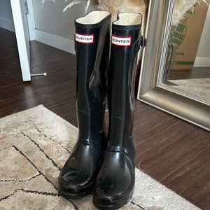 Tall black hunter boots